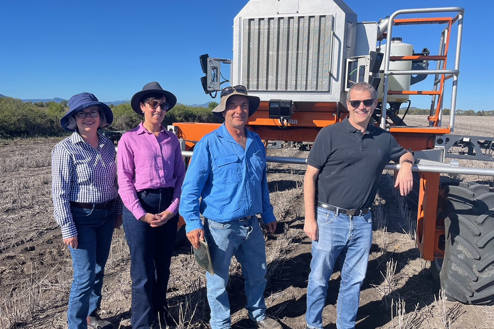 The delegation with Rob Everleigh and “Conan,” the autonomous swarmbot sprayer