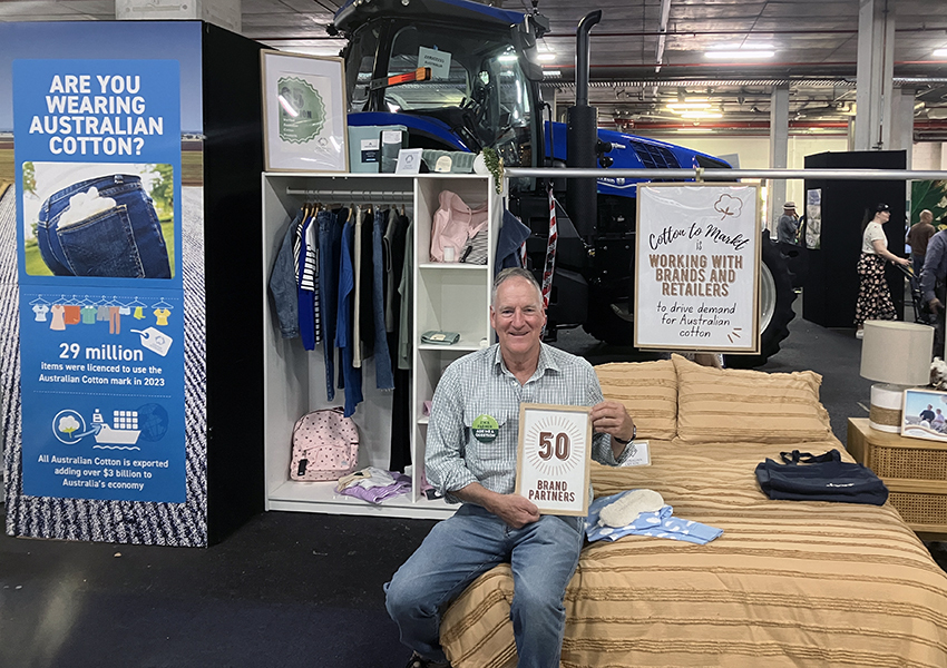 Grower Ian Hayllor in a lifestyle display of cotton products from our brand partners